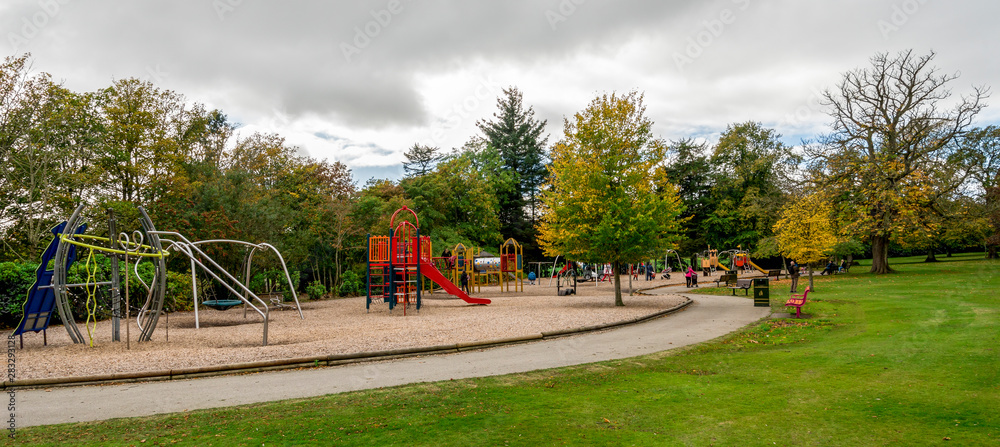 Large children playground area with slides, bars, swings and other equipment in Hazlehead park, Aberdeen, Scotland