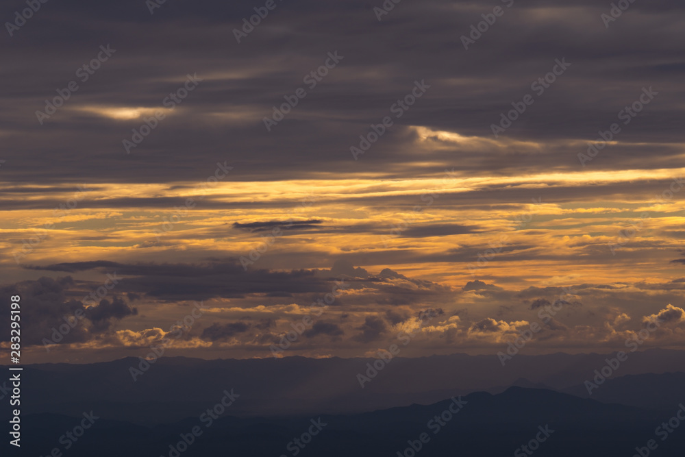 Scenic View Of Silhouette Mountains Against Sky During Sunset and beam Scenic View Of Silhouette Mountains Against Sky During Sunset and beam