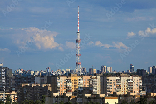 Kiev  Ukraine - July 8  2019  TV Tower made of steel. The antenna of television centre in Kiev  Kyiv  on the residential buildings background