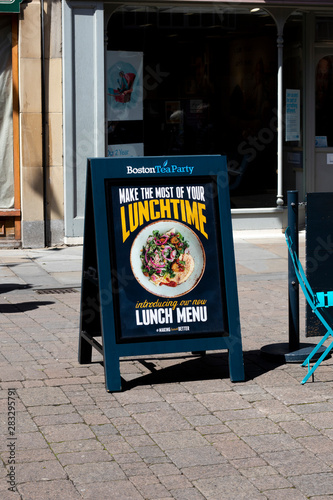 Obraz na plátne Boston Tea Party sandwich board advertising new lunchtime menu