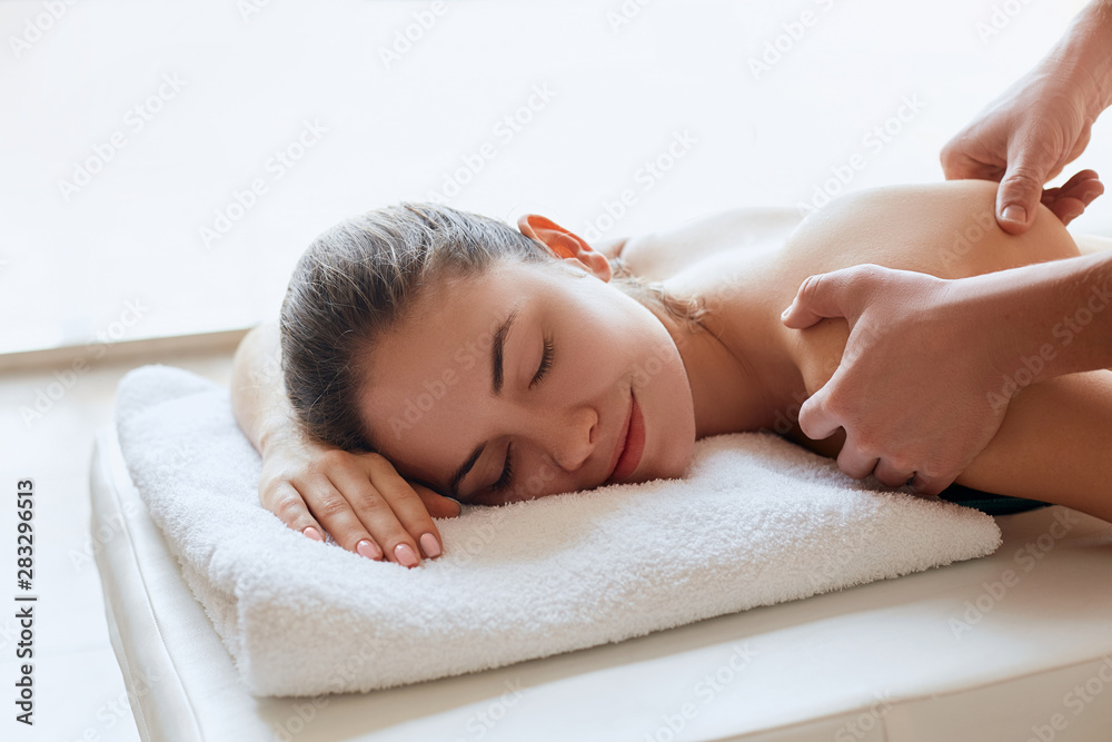 Spa Massage. Close-up of young woman getting spa massage treatment at beauty spa salon.Spa skin and body care. Facial beauty treatment.Cosmetology. Spa Massage. Close-up of young woman getting spa massage treatment at beauty spa salon.Spa skin and body care. Facial beauty treatment.Cosmetology.