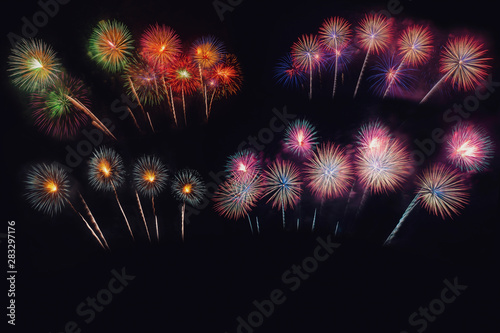Festive beautiful colorful fireworks display on the sea beach, Amazing holiday fireworks party or any celebration event in the dark sky