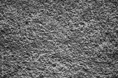 Cement plastered stone wall. Texture, design, background.