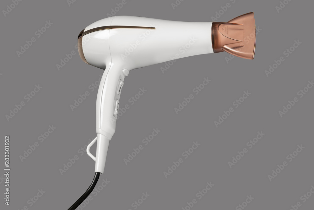 Fototapeta premium Hair dryer isolated on grey