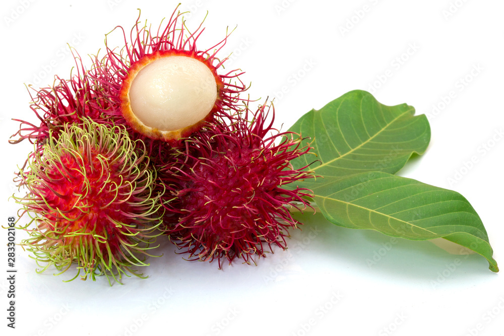 Fresh Rambutan with green leaves isolated on white background Fresh Rambutan with green leaves isolated on white background
