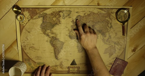 Pointing To Norway On Map With Magnifying Glass Person Deciding Where They're Going To Travel To From A Birdseye View