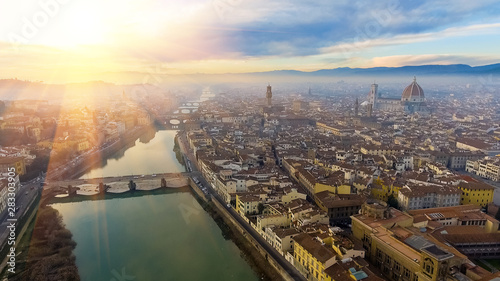 AERIAL. Panorama of the city of FLORENCE in Italy with the dome and Palazzo della Signoria and arno river