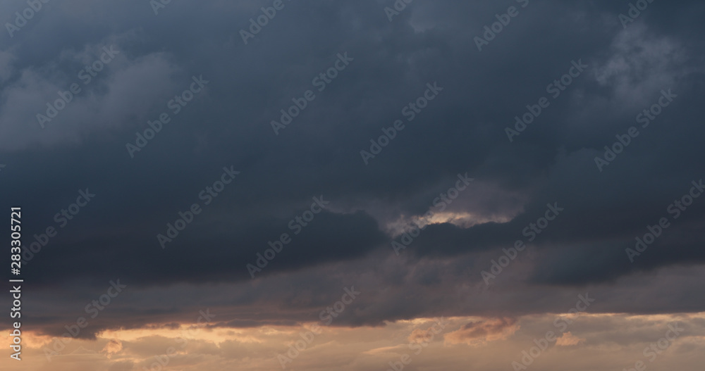 summer sunset skyscape with moving clouds