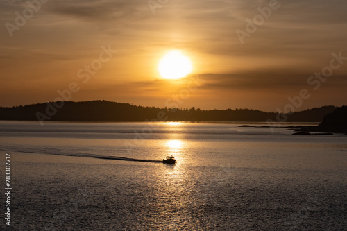 motor boat caught in the sun at sunset Vancouver Island