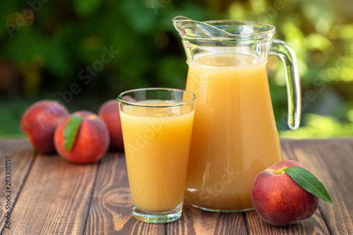 peach juice in glass and jug