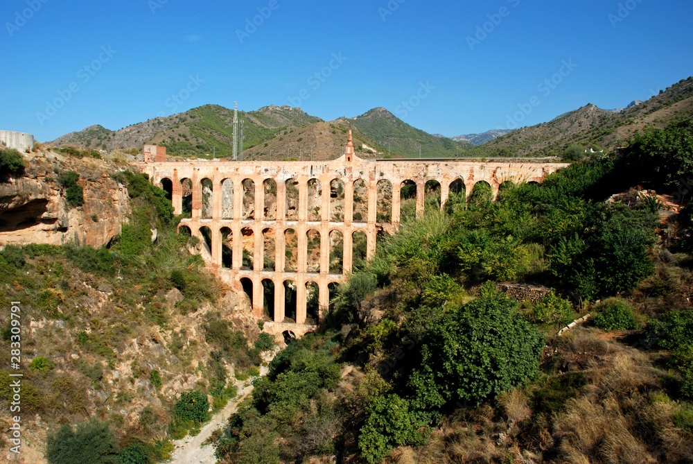 View of the Aqueduct of Aguila built in 1880, Nerja, Andalusia, Spain.