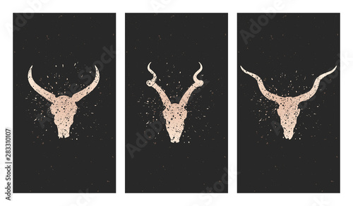 Vector set of three illustrations with gold silhouettes skulls antelope, wild buffalo and grunge elements on black background.