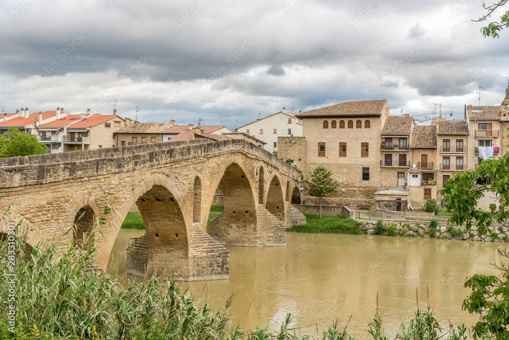 View at the old Romanesque Bridge over Arga river in Puente La Reina - Spain View at the old Romanesque Bridge over Arga river in Puente La Reina - Spain