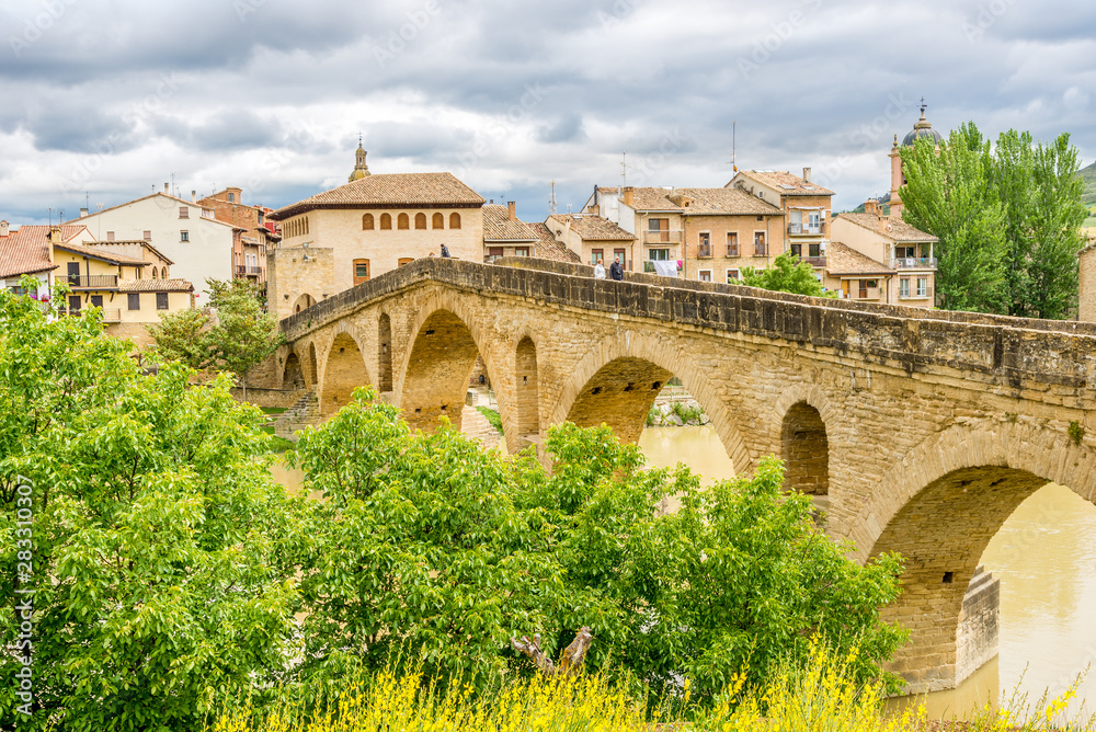 Old Romanesque Bridge over Arga river in Puente La Reina - Spain