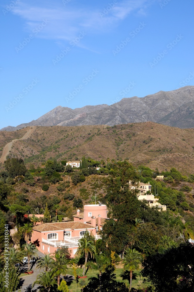 View of villas in the mountains above Marbella, Andalusia, Spain.