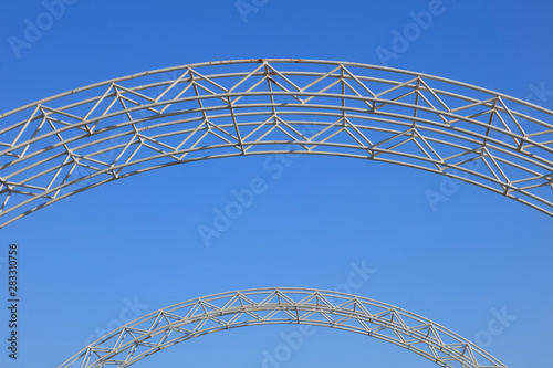 Steel arch in blue sky