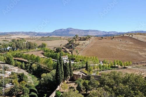 Elevated view across farmland towards the mountains, Ronda, Andalusia, Spain.