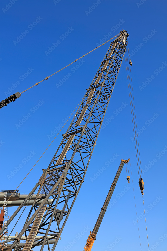 crane arm under blue sky