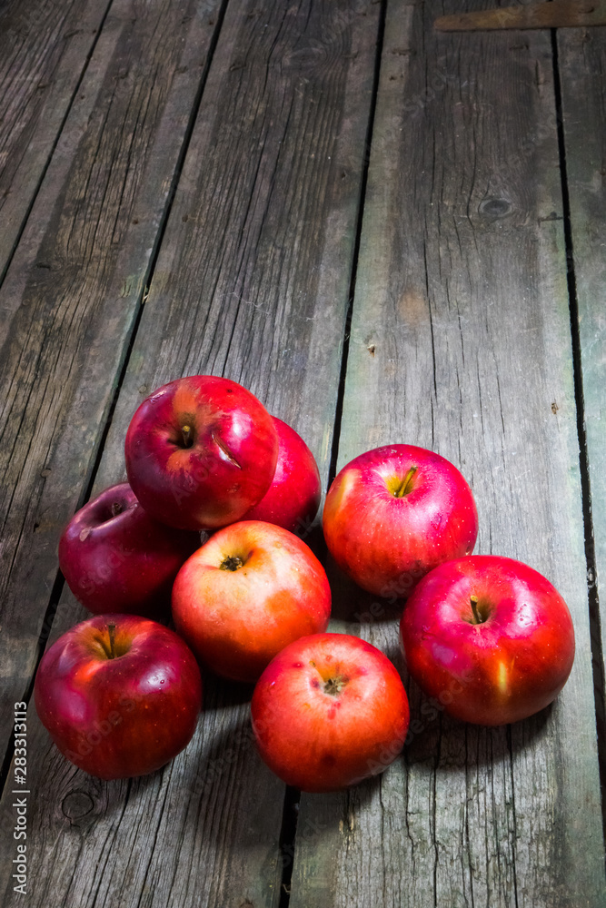 Red apples on a wooden background Red apples on a wooden background