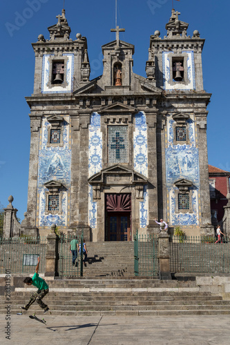 Santo Ildefonso church, with skater doing tricks photo