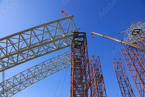 Truss girder and crane