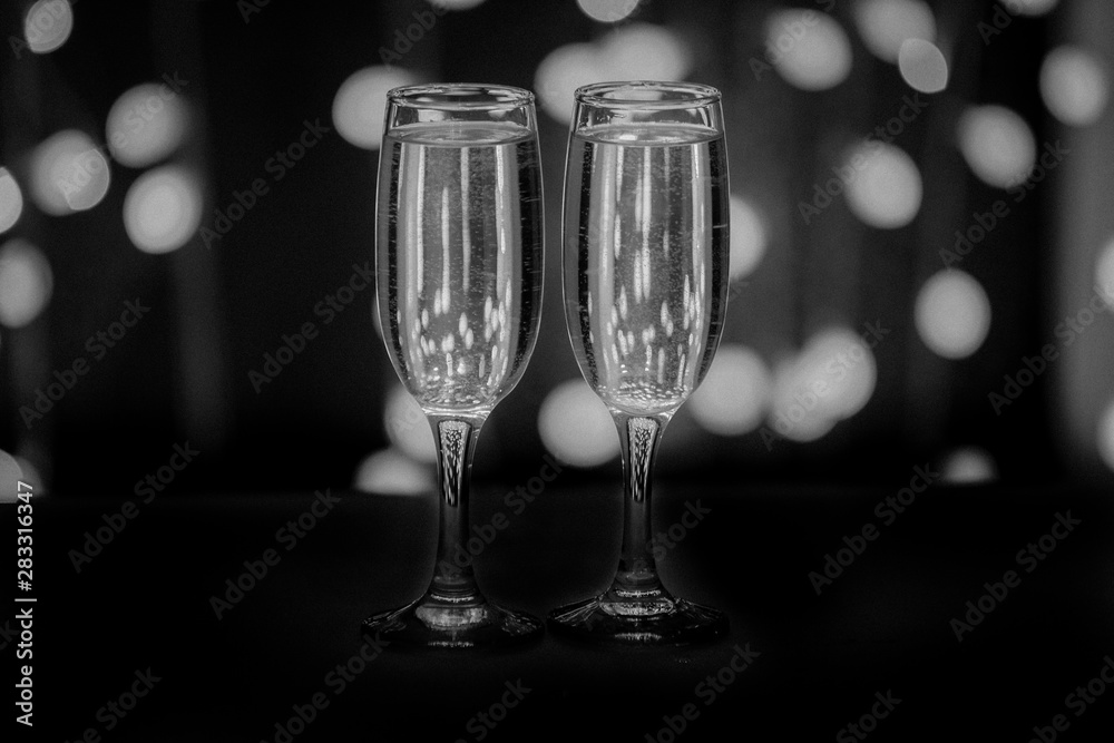 Two glasses on a background of illumination Two glasses on a background of illumination