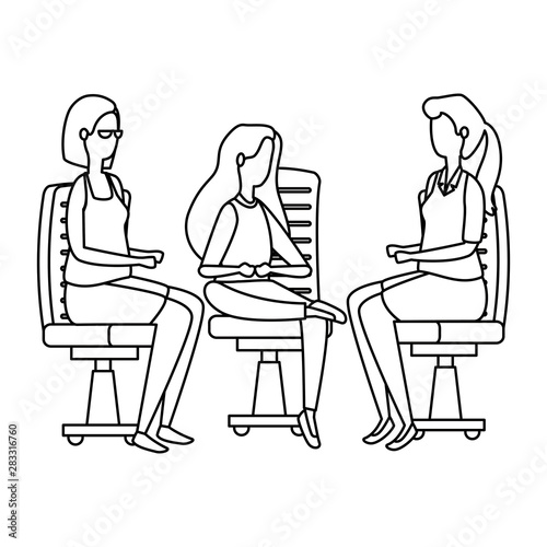 elegant businesswomen workers seated in office chairs