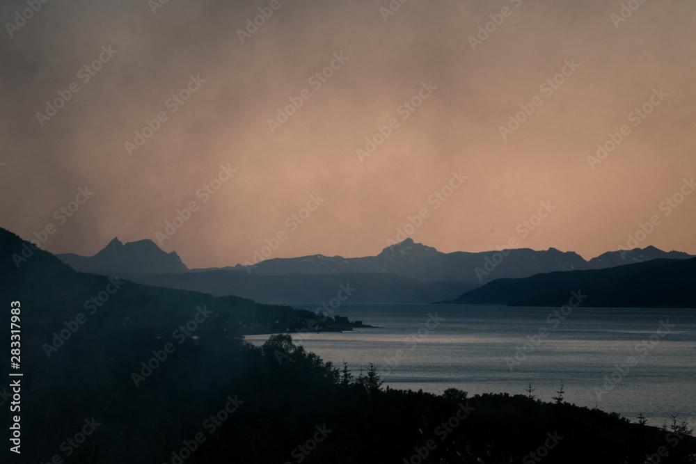 Hazy silhouette of fjords in Northern Norway