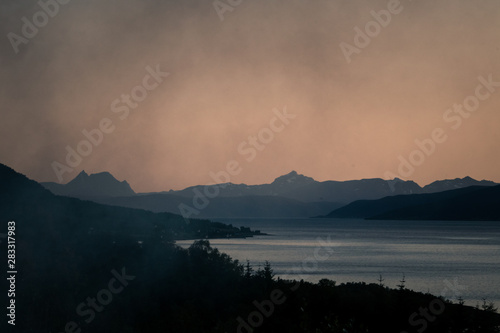 Hazy silhouette of fjords in Northern Norway