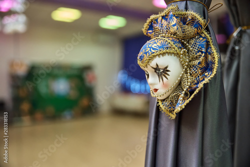 Beautiful carnival mask hanging like decoration in a room