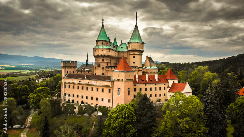 Fototapeta premium Aerial view of Bojnice medieval castle, UNESCO heritage in Slovakia. Romantic castle with gothic and Renaissance elements built in 12th century.
