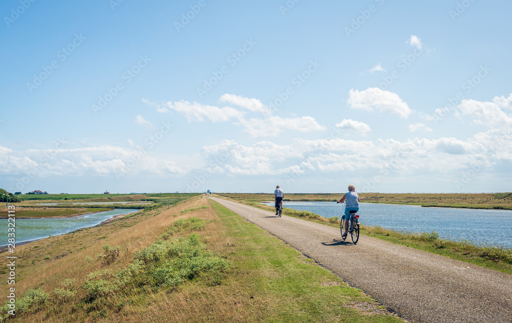 Cyclists on a Dutch dike Cyclists on a Dutch dike