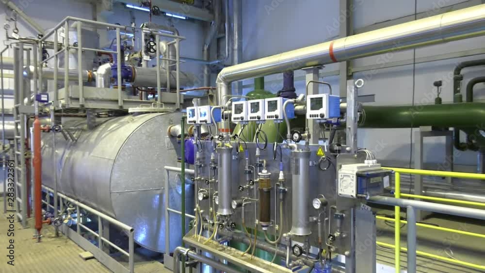 Equipment, cables and piping as found inside of a modern industrial power plant Equipment, cables and piping as found inside of a modern industrial power plant