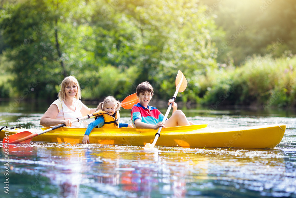 Child on kayak. Kids on canoe. Summer camping. Child on kayak. Kids on canoe. Summer camping.