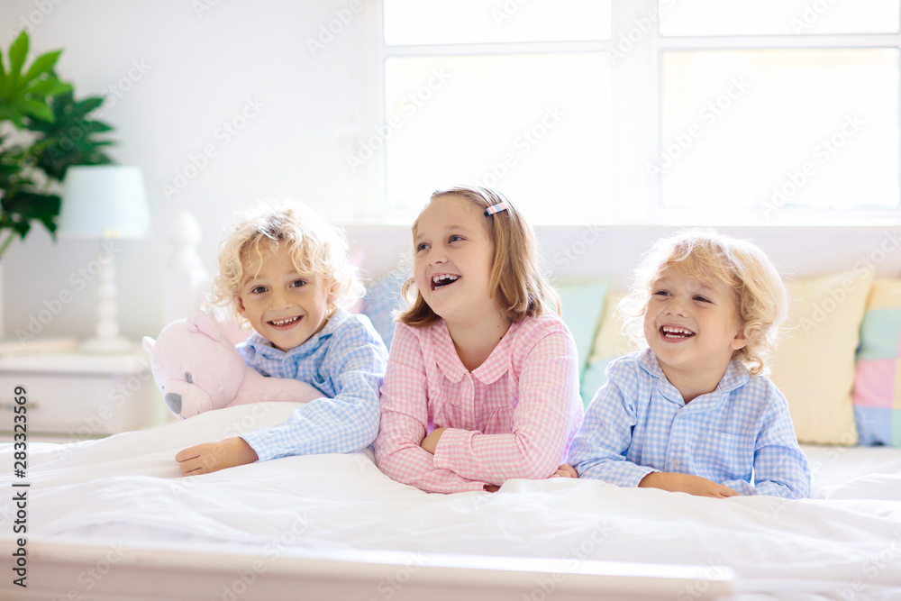 Kids play in bed. Children at home. Kids play in bed. Children at home.