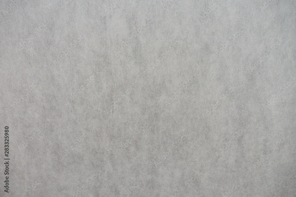 Closeup of grey fabric with texture and design on the wall and background and decoration. Cool banner on page and cover. Monochrome seamless pattern.