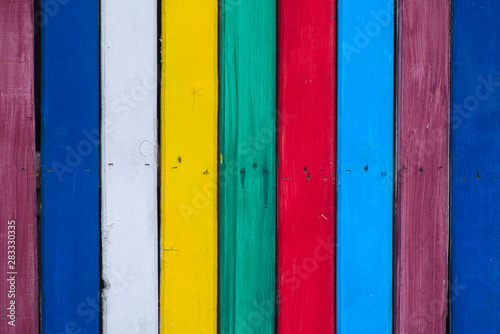 Multicolored wood board wall texture from planks closeup with nails