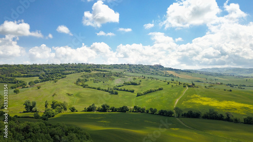 Aerial of of Tuscan field and town of Pienza