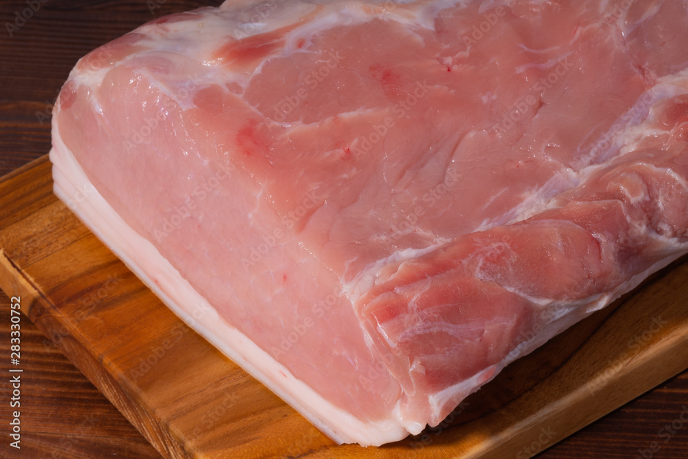 Raw pork on cutting board. clouse up Raw pork on cutting board. clouse up