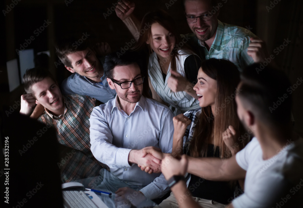 Fototapeta premium handshake of business people in the circle of colleagues