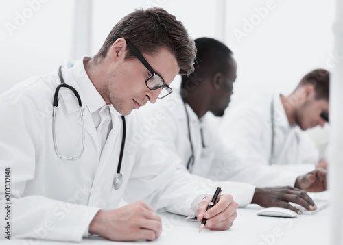 experienced doctor sitting at the laboratory table