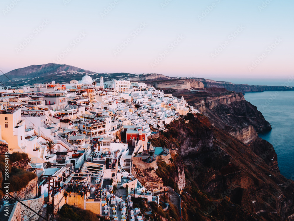 Fototapeta premium Sunset view of Fira, the capital of Santorini, Greece