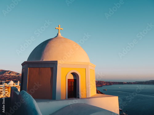 Yellow Church Dome of Fira, Santorini, sunset view