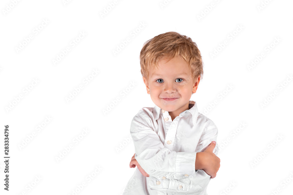 Waist up portrait of a little smiling boy against a white background with copy space in the studio Waist up portrait of a little smiling boy against a white background with copy space in the studio