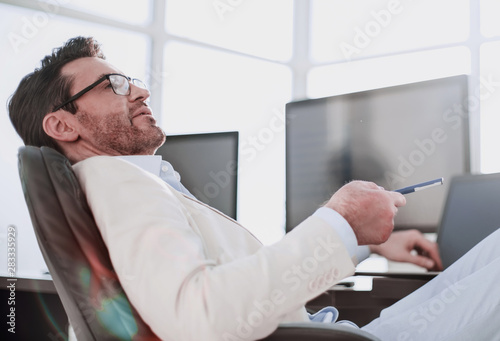 businessman sitting at his Desk during a working break