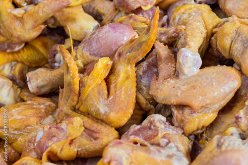 Raw chickens prepared fried in a pan