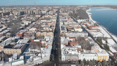 Snowy city in winter and river pier