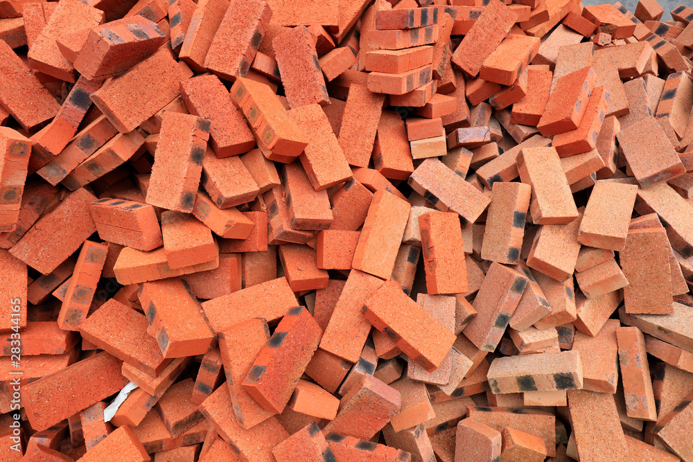 Red bricks piled together Red bricks piled together
