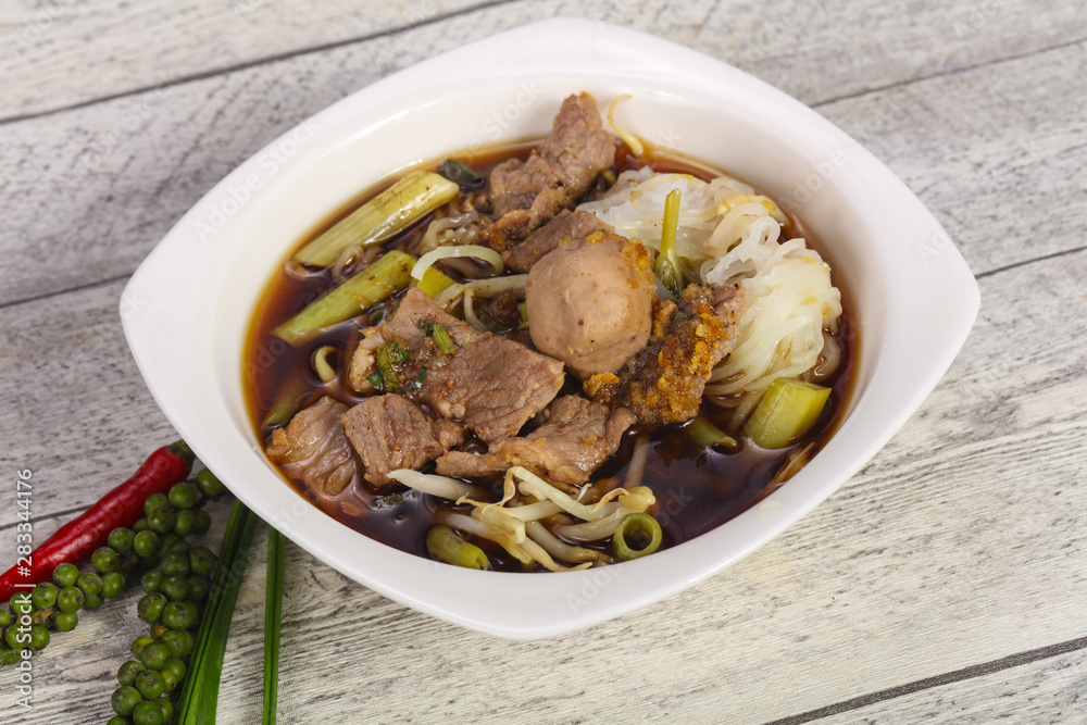 Thai style soup with meat and mushrooms