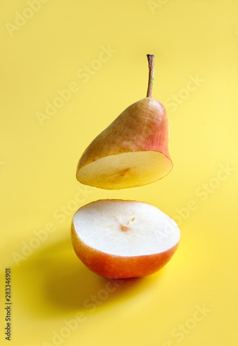 sliced pear on a bright yellow background